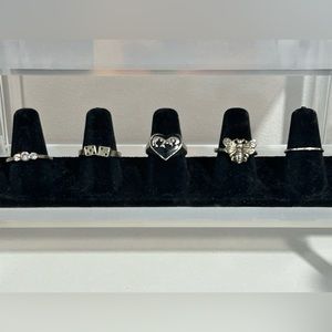 5 silver rings, sizes range from 7-8